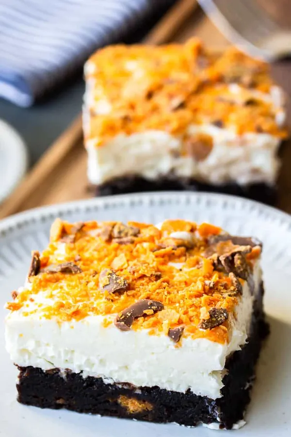 Butterfinger Cheesecake Bars on Brownie Crust